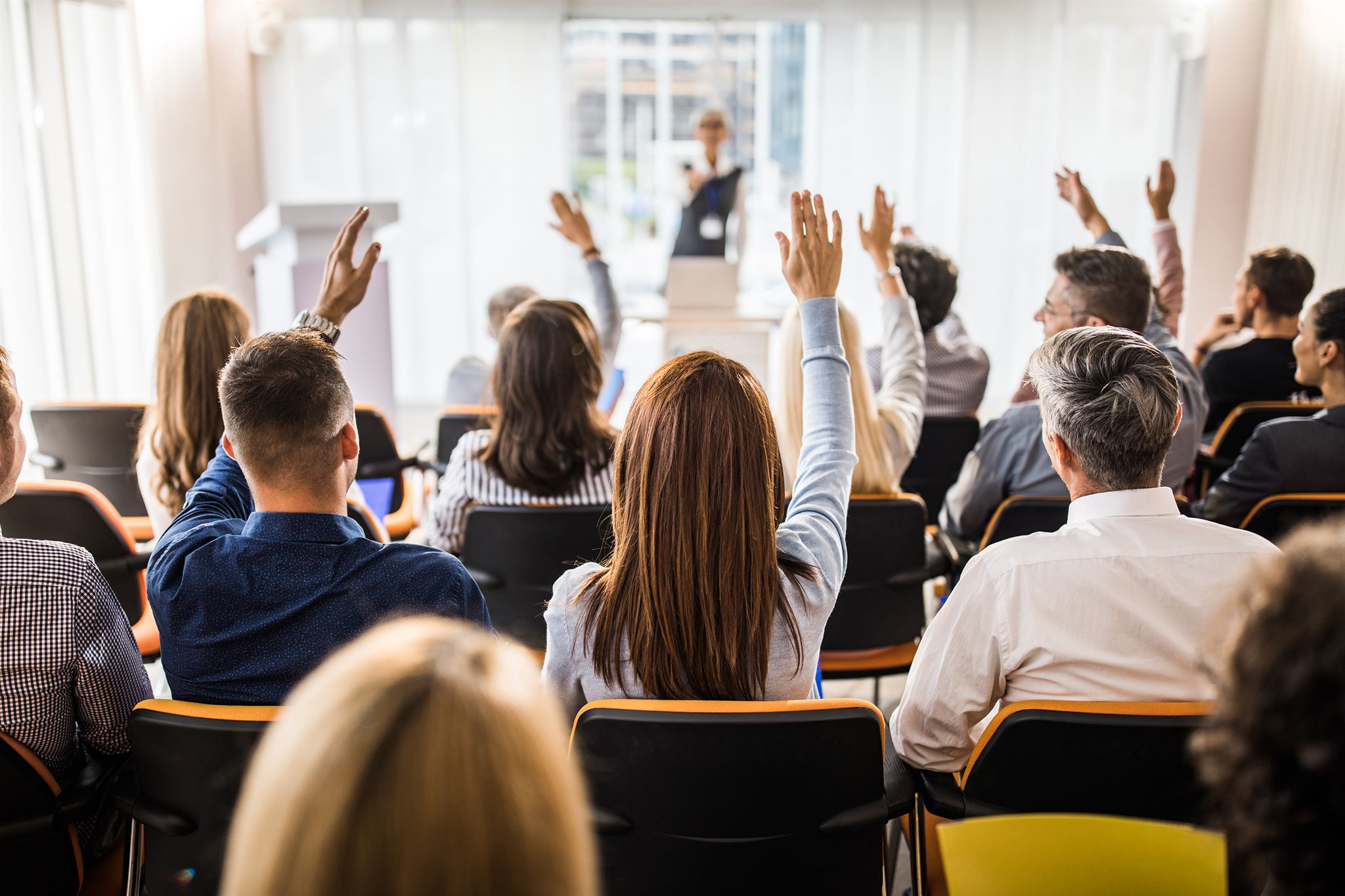 Hands-held-up-high-during-a-conference